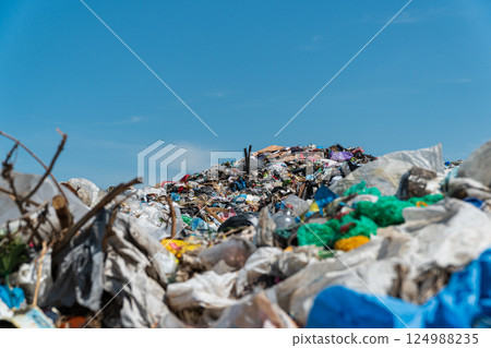 Garbage dump pile in landfill. Garbage dump, various trash and waste material 124988235