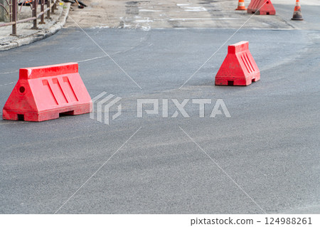 Plastic road fencing on the road Plastic road fencing on the road 124988261