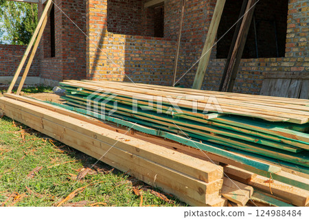 Boards for construction. Boards for building a house. Building material Boards for construction. Boards for building a house. Building material 124988484