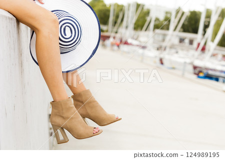 Woman in high heels and jumpsuit 124989195