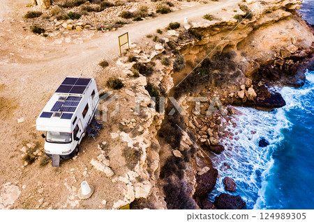 Camper on coast in Spain. Aerial view 124989305