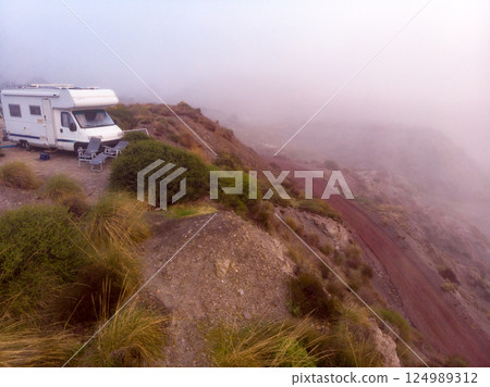 Caravan camping on misty coast, Spain. Caravan camping on misty coast, Spain. 124989312