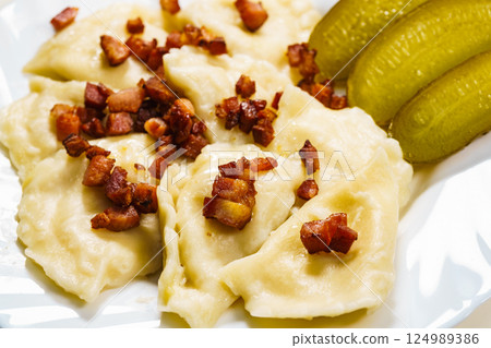 Dumplings with meat bacon scratchings. Dumplings with meat bacon scratchings. 124989386