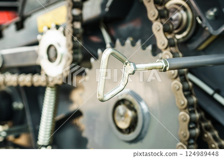 Chain and sprockets in big machine 124989448