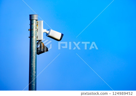 Security video camera against sky. Security video camera against sky. 124989452