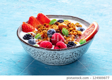 Granola with yogurt and fresh fruit. Organic gourmet muesli with ingredients Granola with yogurt and fresh fruit. Organic gourmet muesli with ingredients 124989877