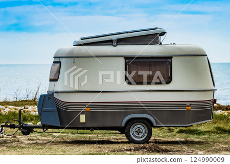 Caravan trailer camping on coast, Spain. 124990009