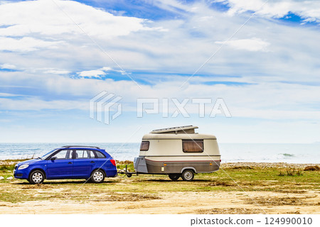 Caravan trailer camping on coast, Spain. 124990010