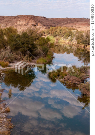 Clouds reflected in the Fish river 124990030