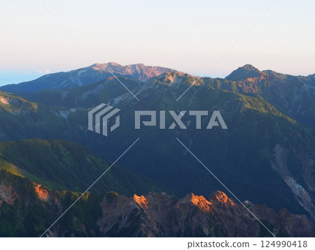 Mt. Suisho and Mt. Yakushi seen at sunrise from Mt. Yari in summer Mt. Suisho and Mt. Yakushi seen at sunrise from Mt. Yari in summer 124990418