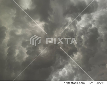 Background image 2 of a dark gray cloudy sky covered with rain clouds 124990598