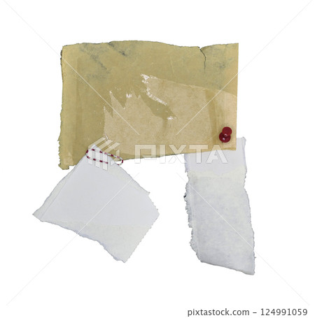 Pieces of paper held together with pins and clip isolated on white background 124991059