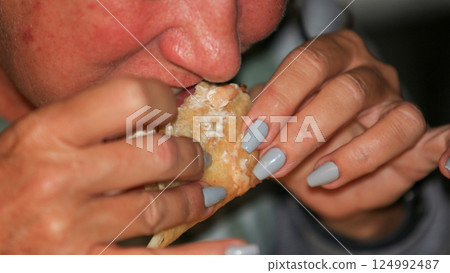 Enjoying a Crispy Dish at a Gathering Enjoying a Crispy Dish at a Gathering 124992487