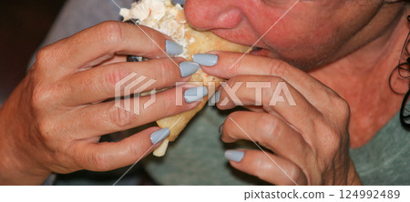 Enjoying a Tasty Taco at a Casual Dining Spot 124992489