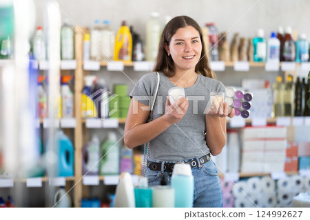 Woman choosing scented candles 124992627