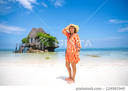 Woman enjoys vacation in Zanzibar, experiencing its beauty Woman enjoys vacation in Zanzibar, experiencing its beauty 124992940
