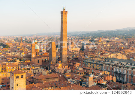 Bologna's iconic Two Towers, Asinelli and Garisenda, stand tall over the historic city. 124992943