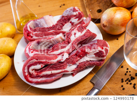 Raw beef brisket served at table 124993178