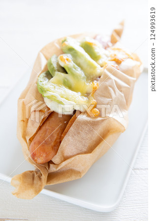 Delicious avocado cheese sausage dog 124993619