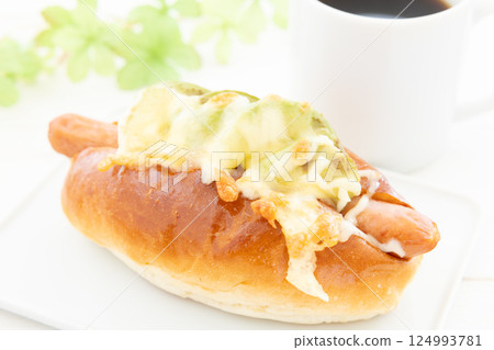 Delicious avocado cheese sausage dog and hot coffee Delicious avocado cheese sausage dog and hot coffee 124993781