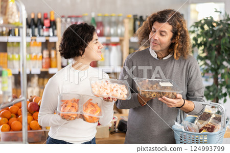 Couple chooses shrimp and sea snails Couple chooses shrimp and sea snails 124993799