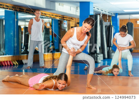 Woman doing wristlock Woman doing wristlock 124994073