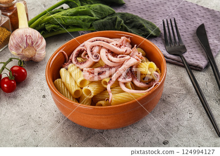 Italian cuisine - pasta tortiglioni with squid 124994127