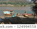 Sand transport ship in Laos 124994558