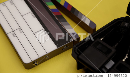 Digital Clapper Board for filmmaker in set. Timecode Slate to use in professional Video Production. Digi number clapperboard or film slates on set. Tools in movie shooting and modern cinema industry. 124994820