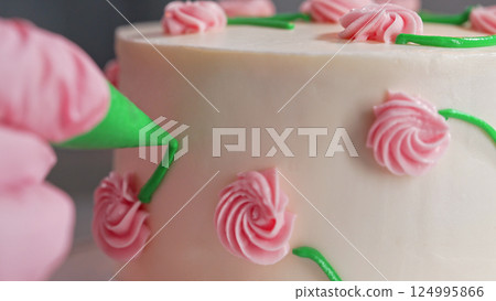 Chef Hands Decorating Bento Cake with Cream Roses. Pastry Art, Floral Details. 124995866