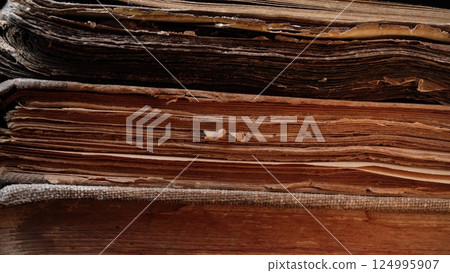 Aged Book Spines In Macro. Vintage Texture, Timeworn Details. Frayed edges pages 124995907