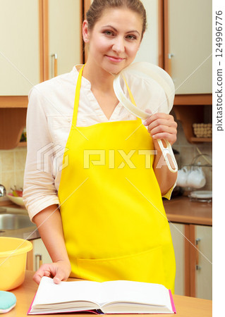 Housewife planning and preparing meal 124996776