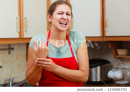 Woman checking pulse on wrist. Woman checking pulse on wrist. 124996793