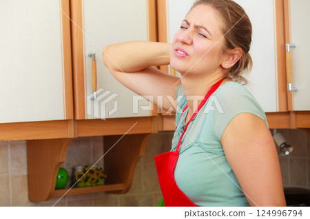 Overworked woman suffering from neck pain. Overworked woman suffering from neck pain. 124996794