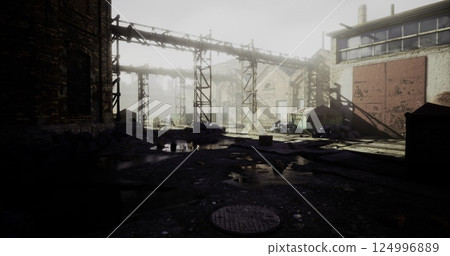 Exploring an abandoned industrial site with fog and scattered debris 124996889