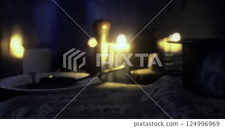 Candlelit dinner table set for an intimate evening 124996969