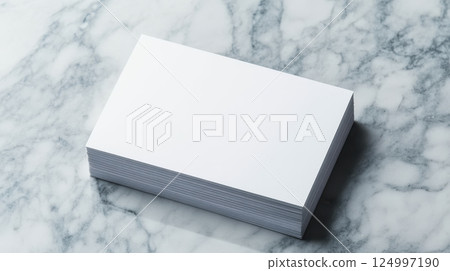 Elegant blank business cards stacked on marble surface, showcasing minimalist design perfect for professional use. Ideal for networking and branding opportunities 124997190