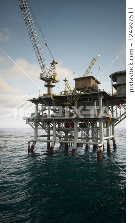 Aging Oil Rig in Vast Ocean Aging Oil Rig in Vast Ocean 124997511
