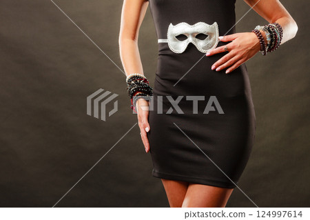 Woman with carnival venetian mask on dark Woman with carnival venetian mask on dark 124997614