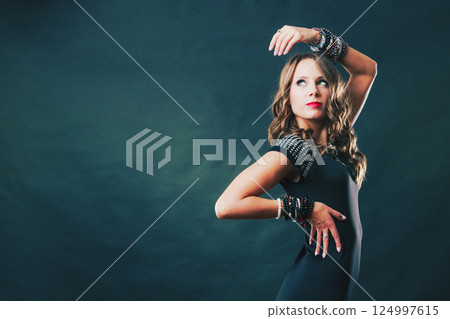 woman with jewellery in black evening dress 124997615