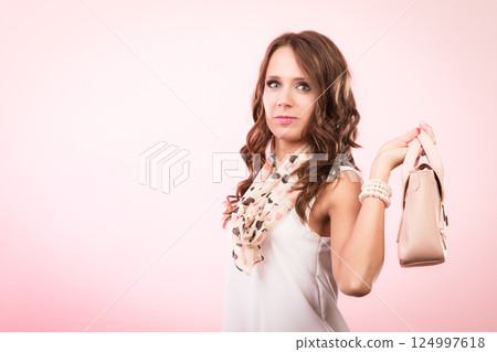 Fashionable girl holding bag handbag. Fashionable girl holding bag handbag. 124997618