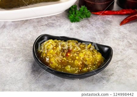 Souce gherkin relish with marinated cucumbers 124998442