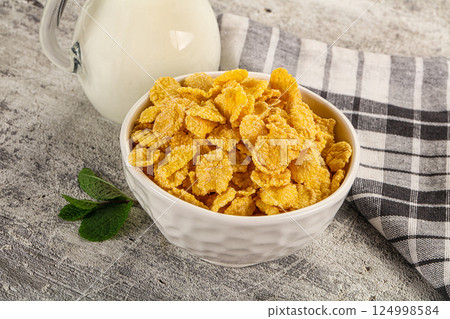 Corn flakes with milk for breakfast Corn flakes with milk for breakfast 124998584