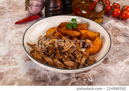 Baked shredded pork with potato 124998592