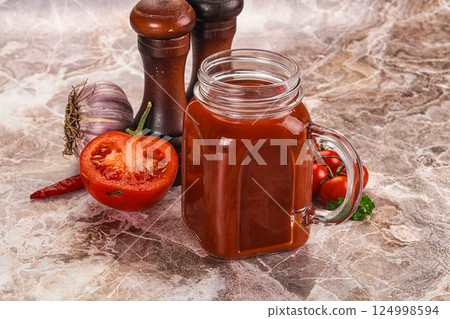 Fresh tomato juice in the glass 124998594