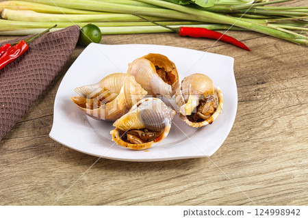 Snails baked with garlic and spices Snails baked with garlic and spices 124998942
