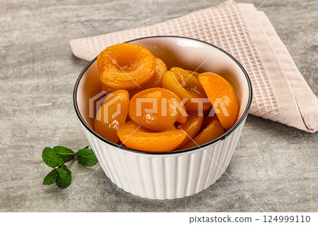 Sweet canned apricots with syrope 124999110