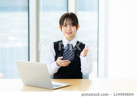 A young business woman at the reception A young business woman at the reception 124999604