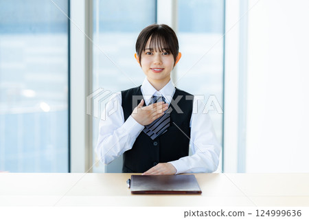 A young business woman at the reception A young business woman at the reception 124999636