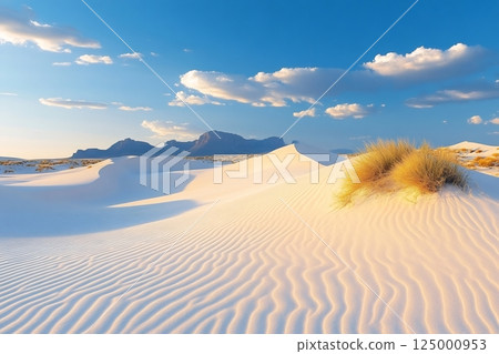 Mesmerizing white sand dunes glowing under dramatic sky at White Sands National Park 125000953
